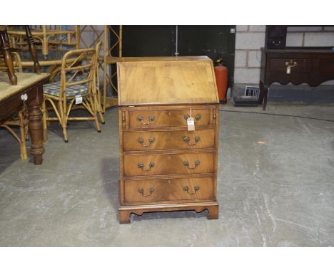 A Good quality Georgian style bureau , mid 20th Century,The rectangular crossbanded fall front enclosing a compartmentalized 