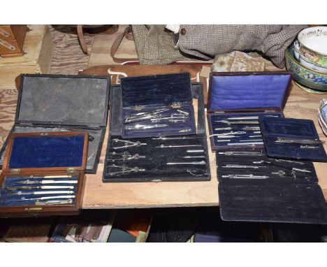 A collection of architects drawing instrumentsThe seven cases include a wooden cased example with bone handled compass and wo