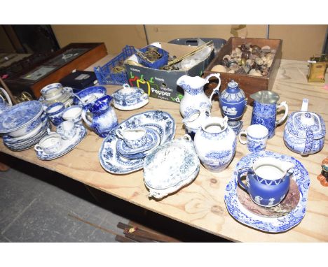 A large quantity of blue and white ceramicsTo include Spode platter with canted corners, Spode teapot, Spode jug, ironstone j