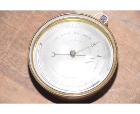 A 19th Century brass cased 'PHBN' holosteric barometer Having a 12cm silvered dial and a crescent shaped thermometer. 