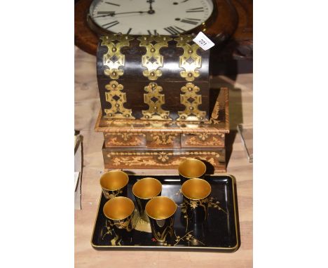 A coromandel and brass arched boxThe rectangular formed box with domed hinged lid with compartmentlised interior with three c
