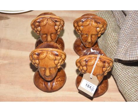 A set of four sash window rests, 19th CenturyThe treacle glazed window rests in the form of a woman, height 14cm. (4) 