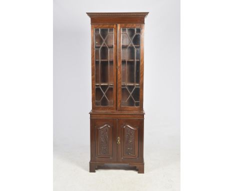 A good quality Georgian style mahogany library bookcaseThe dentil cornice above a pair of astragal glazed doors enclosing thr