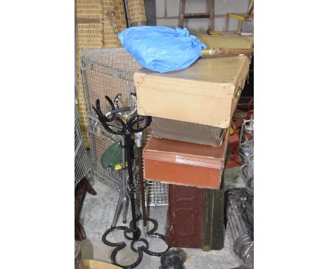 An iron horse shoe plant standThe bowl shaped stand and base constructed from horse shoes along with a vintage tin trunk, thr