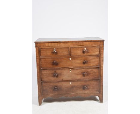 An early 19th Century mahogany chest of drawersHaving an arrangement of two short and three long cockbeaded drawers each appl