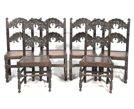 A set of six oak Jacobean revival dining chairs, late 19th CenturyEach chair with two carved and scalloped rails above a boar