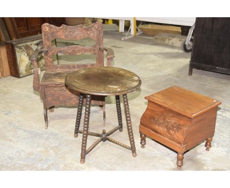 A Gypsy style tableThe circular top raised upon four bobbin turned supports with conforming cross stretchers, (60cm diameter)