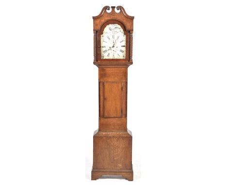 A George III oak cased eight day longcase clockTJ Truscott, St Ausell, having a twin swan neck pediment above spinally lobed 