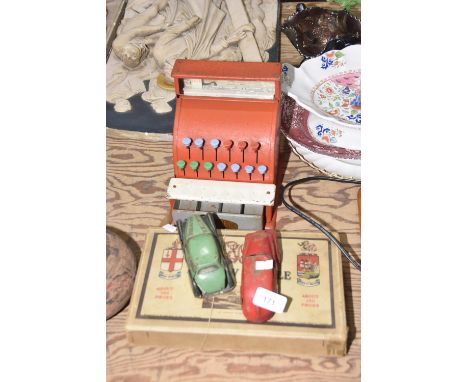 A group of vintage toysTo include a galvanised metal Codeg cashiers till together with two French model cars and jigsaw puzzl