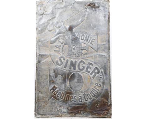 A vintage French 'Singer' sewing machine galvanized metal advertising sign The sign with bold relief lettering 'La compagnie 