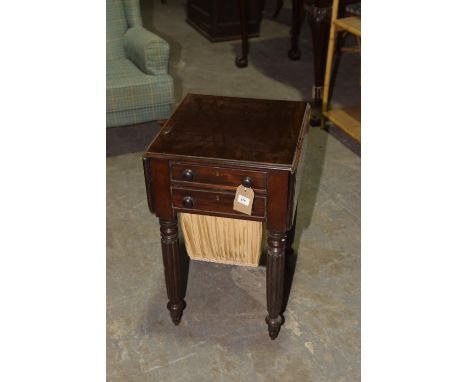 A mid 19th Century mahogany work tableThe rectangular drop leaf top with rounded corners above two drawers each applied with 