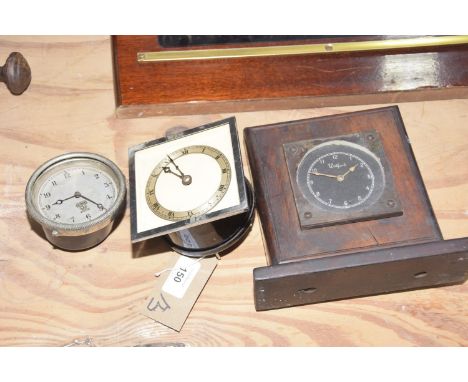 Three early 20th Century automobile clocks To include a clock signed Watford within a mahogany case, a Smiths of London clock