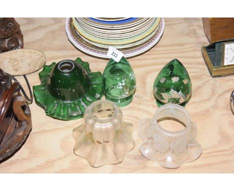 A collection of glass light shadesTo include two green glass fluted rim examples, a smokey glass fluted rim example with leaf