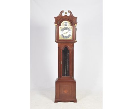 A reproduction Georgian style long case clock by Richard Broad, CornwallHaving a swan neck pediment above reeded columns flan