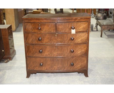 A 19th Century mahogany bowfront chest of drawersWith two short and three long graduated cockbeaded drawers each applied with