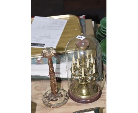 A wooden 20th Century wig standOf typical form on circular base (height 26cm)  Together with a glass cased brass bobbin holde