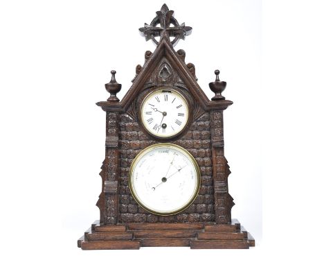 A Victorian oak clock barometer The architectural Gothic case enclosing the 8cm white enameled clock dial with single train m