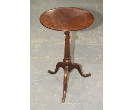 A 19th Century mahogany tripod tableThe circular top on a ring turned tapering shaft with three down swept supports, 44cm dia