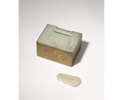 A CHINESE PALE CELADON JADE PLAQUE INSET IN A GILT-COPPER BOX AND A WHITE JADE PENDANT 19TH CENTURY The plaque formed as a lo