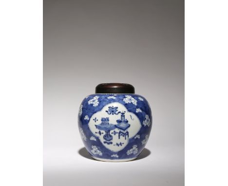 A CHINESE BLUE AND WHITE 'HUNDRED ANTIQUES' VASE KANGXI 1662-1722 Painted with three quatrefoil cartouches containing archais