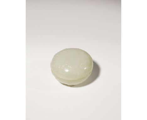 A CHINESE PALE CELADON JADE 'FOUR GENTLEMEN' CIRCULAR BOX AND COVER QING DYNASTY Carved in relief with sprays of bamboo, chry