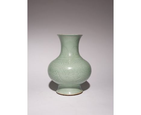 A CHINESE CELADON GLAZED CHILONG VASE LATE 19TH CENTURY Carved to the exterior with two chilong clutching branches of lingzhi