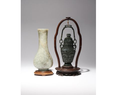 A CHINESE CELADON JADE PEAR-SHAPED VASE AND A SPINACH-GREEN JADE VASE AND COVER MING  AND QING DYNASTY The pear-shaped vase c