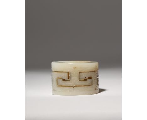 A CHINESE PALE CELADON JADE CYLINDER LATE QING DYNASTY Carved in openwork with an interlocking design of 'T' scrolls, the ext
