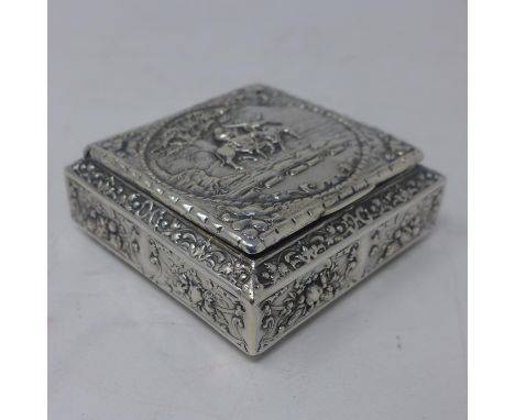 A French silver snuff box, with repousse embossed decoration with vignette of scene from Exodus of Egypt within a scrolling f
