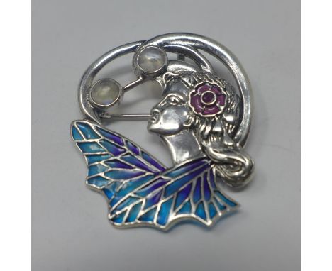 A sterling silver brooch/pendant in the Art Nouveau style set with enamel ruby and moonstones, 3.5 x 3cm, 8g 