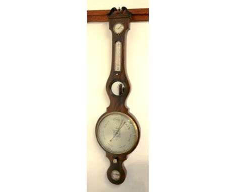  A mahogany wheel barometer,   with mercury thermometer the silvered dial showing the usual observations above a 10inch silve