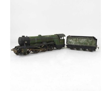 An early 20th century Bassett-Lowke tinplate toy model of The Flying Scotsman steam train, with tender, 53cm long overall