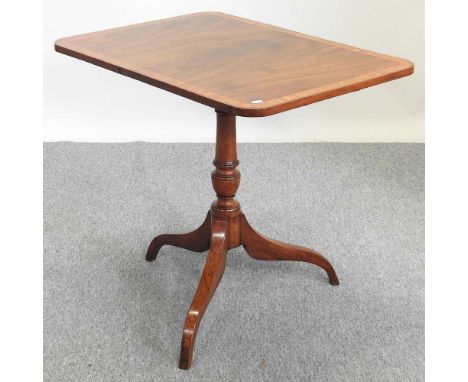 An Edwardian mahogany occasional table, with a hinged top, on a tripod base76w x 56d x 70h cm