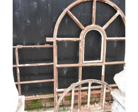 An antique iron arched window frame, together with two smaller frames (3)Arch 1106w x 136h cm overall