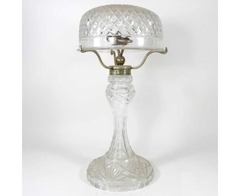 A brass mounted cut glass table lamp and shade