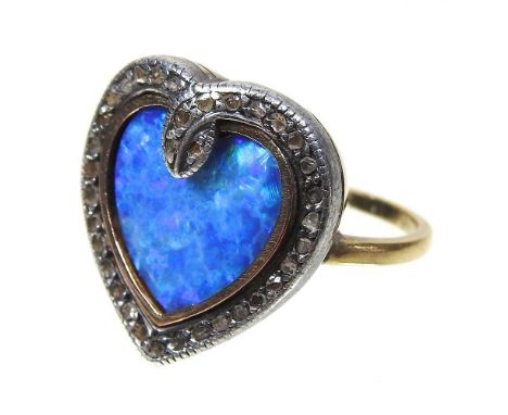 An 18 carat gold black opal heart shaped ring, within a diamond chip surround, size M, 6.2g, 17mm wide