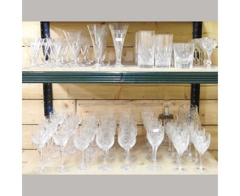 A large collection of various crystal and cut glass drinking glasses, to include a cut glass lamp and wine glasses