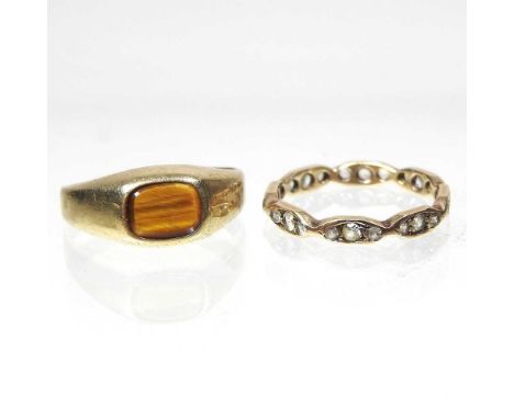 A 9 carat gold tiger's eye signet ring, 1.6g, size I, together with a full hoop eternity ring, 1.3g, size I (2)