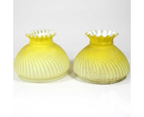 Two yellow glass oil lamp shades, 14cm aperture (2)Both are dirty, with very light surface marks. One has what looks like lea