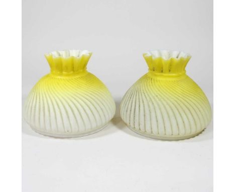 A pair of Burmese yellow glass peg oil lamp shades, 12cm high(2)Both are very dirty, with some very light chips around the li