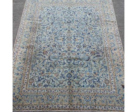 A Persian carpet, with all over scrolled designs, on a turquoise field, 395 x 295cmOverall usable, but with some signs of gen