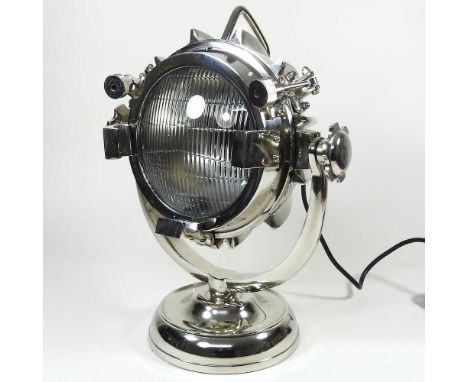 A table lamp in the form of a spotlight