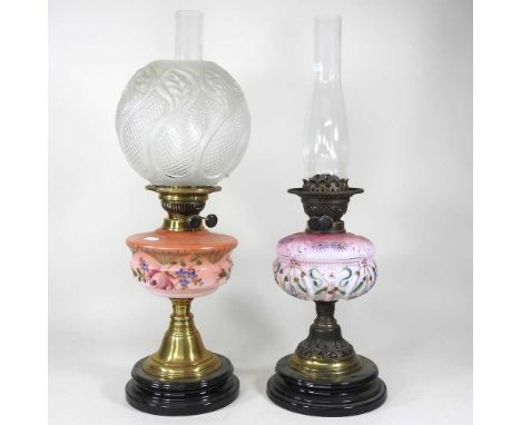 A 19th century opaline glass oil lamp, 32cm high, together with another with a moulded glass shade (2)