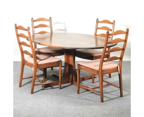 An Ercol oval dining table, together with a set of four matching dining chairs (5)164w x 123d x 74h cm