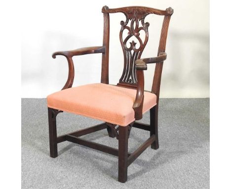 A Chippendale style carved mahogany open armchair, 20th century, on square legs