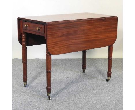 A Regency mahogany pembroke table, on ring turned legs and castors91w x 108d x 73h cm