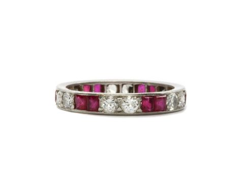 A synthetic ruby and diamond full eternity ring,with pairs of square step cut synthetic rubies, one deficient, alternating wi