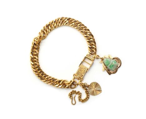 A gold double curb link bracelet, with ladder snap clasp, tested as approximately 18ct gold, suspending a gold heart shaped c