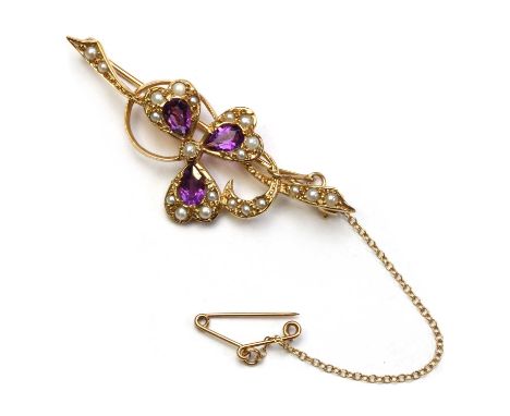 A 9ct gold amethyst and split pearl shamrock brooch, with pear mixed cut amethyst and split pearls grain set to the leaves, t