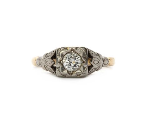 A gold single stone diamond ring,a brilliant cut diamond, grain set to a box collet, to carved tapered shoulders and a plain 